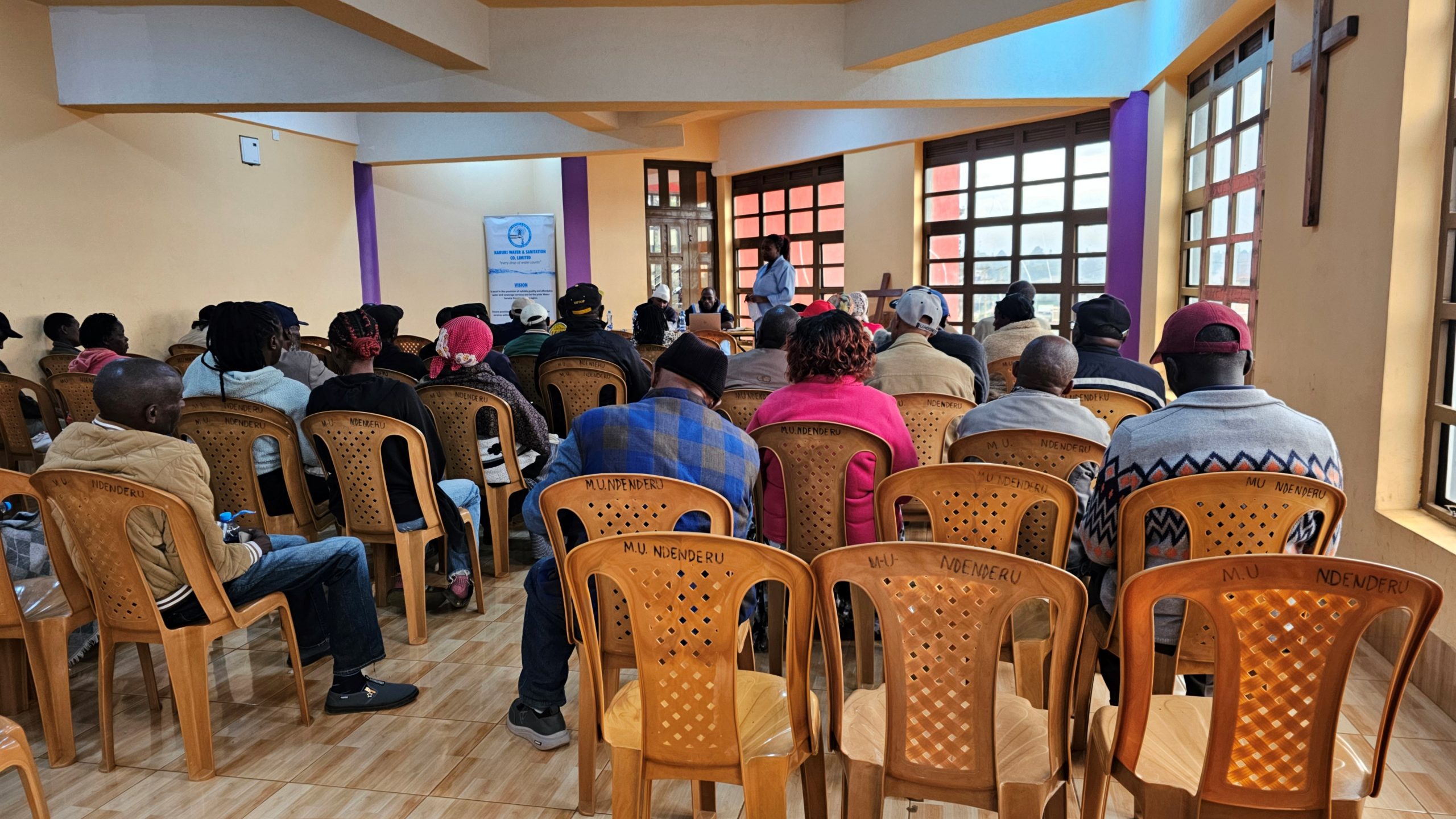 Residents seated inside ACK St. Andrews Ndenderu Church during the KAWSCO customer clinic